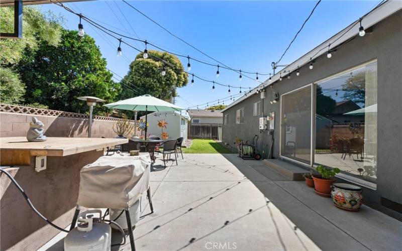 View of custom BBQ and backyard