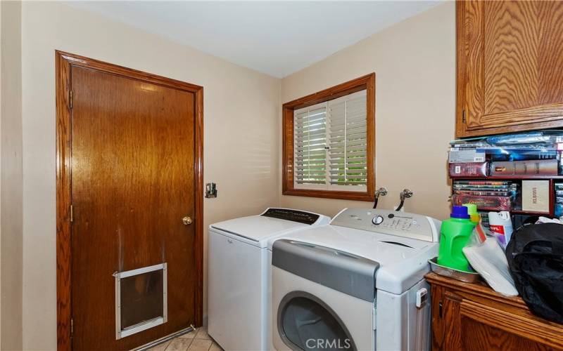 Main Level Laundry Room With Garage Access