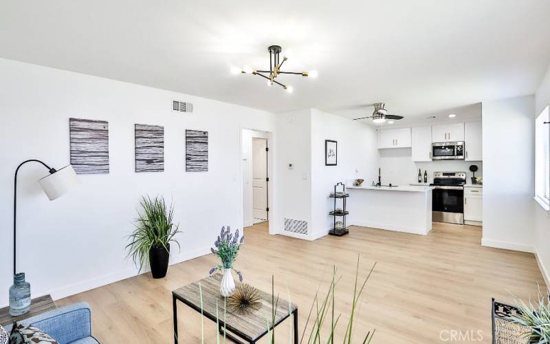 Living room open to dining and kitchen