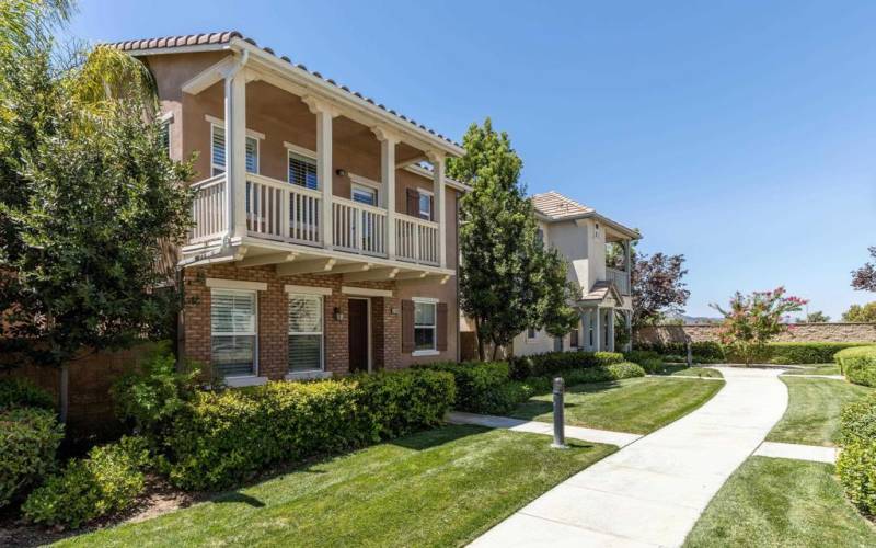 Beautiful grassy walkway to home front but park in back. This way, no garage on front : )