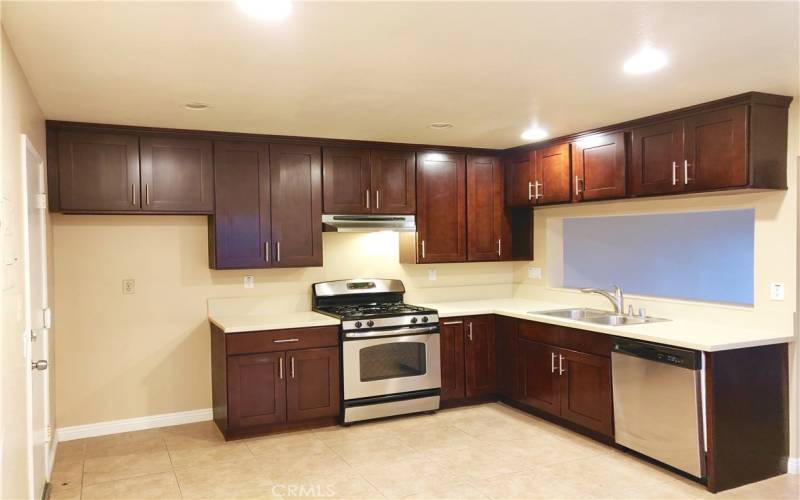 Upgraded Kitchen with Door Leading to Attached Garage