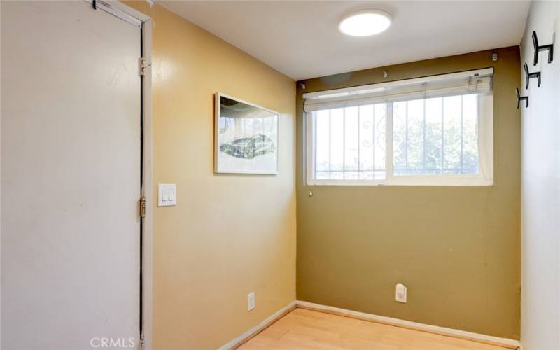 End unit with window in the kitchen dining area, next to garage door entrance.