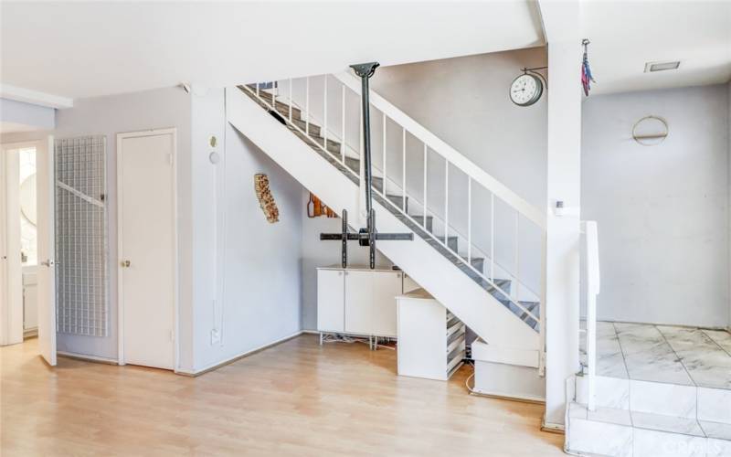 Half Bath, walk-in pantry, and TV bracket in living room