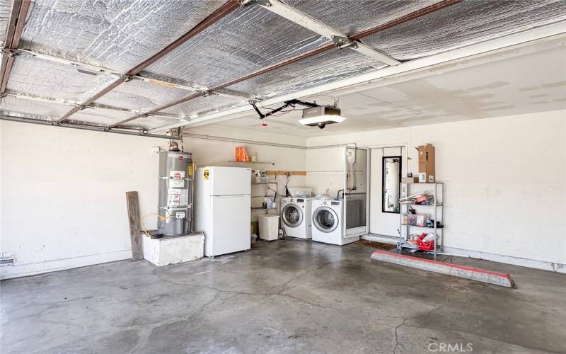 Water heater, washer, dryer in garage.