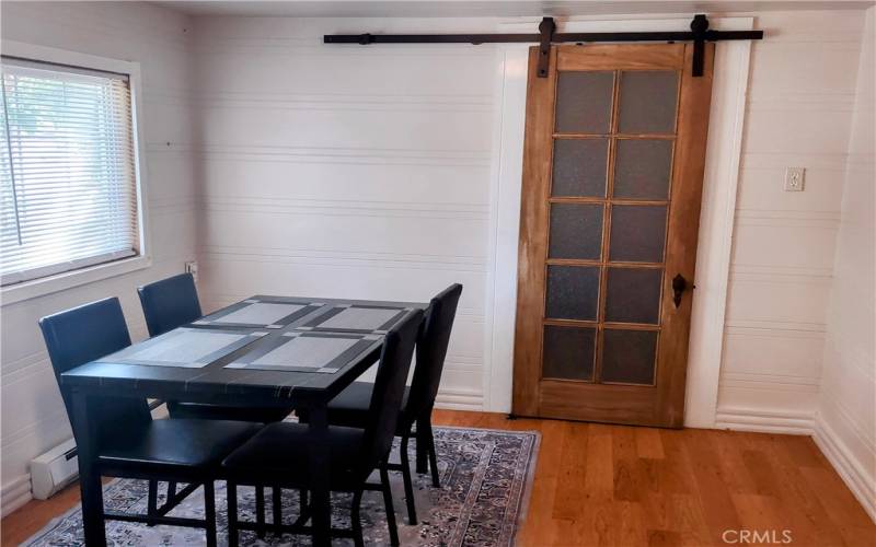 dining room with antique barn door