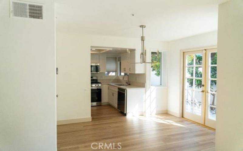 Dining area off kitchen with French doors to rear yard.