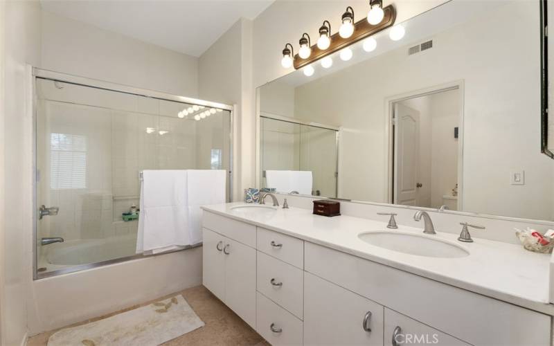 Master bathroom with dual sinks,