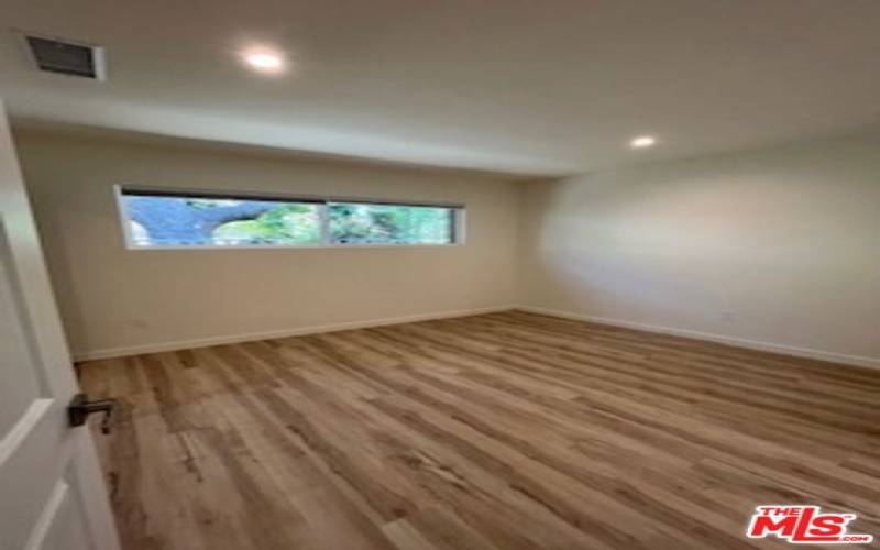 Bedroom with wood floors