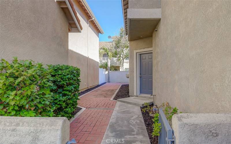 Private entry to front door and yard.