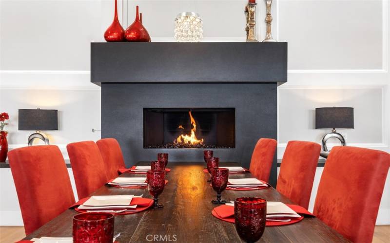 Elegant and cozy dining room with fireplace.