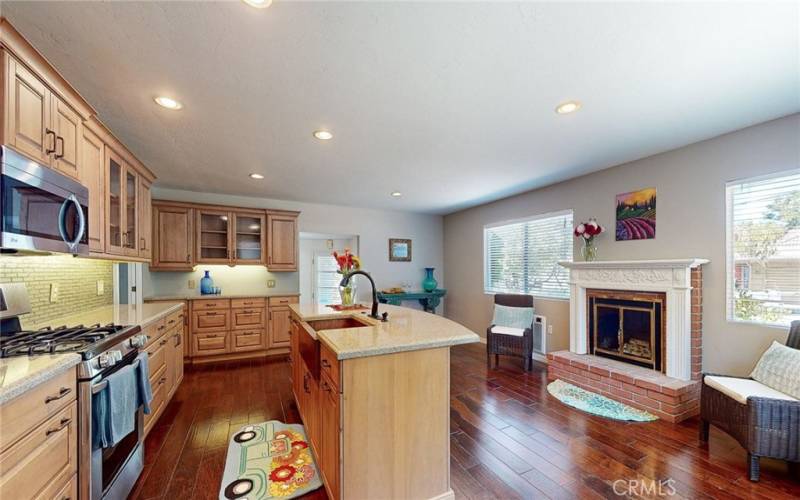 Lovely kitchen remodeled with hardwood flooring, multiple cabinets and granite countertops.