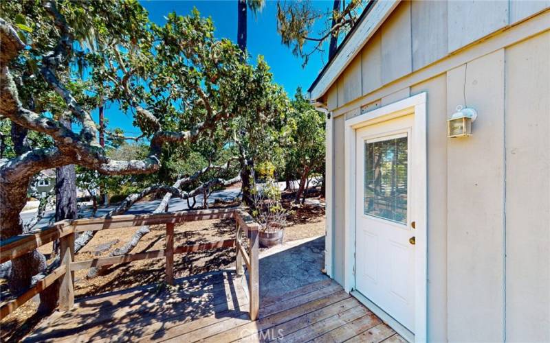 Deck leads into large room on North side of house