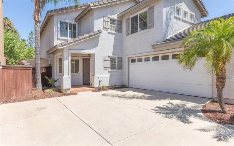 Bright two-story home with a large driveway