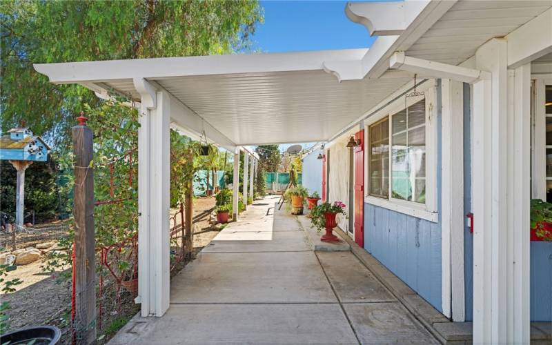 Left of front door with cover patio by french doors