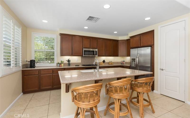 Roomy kitchen with breakfast bar, love the kitchen window view!