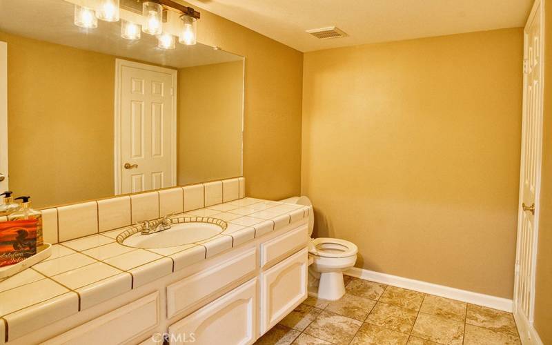 downstairs half bath with large closet!