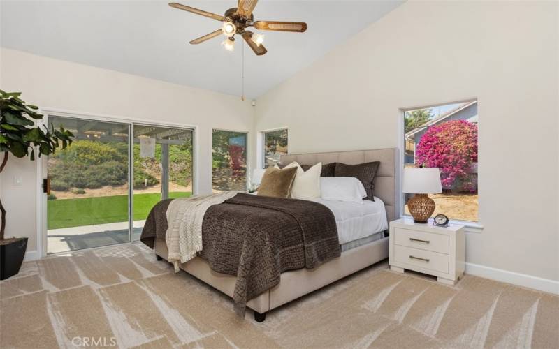 Primary Bedroom with sliding door to backyard