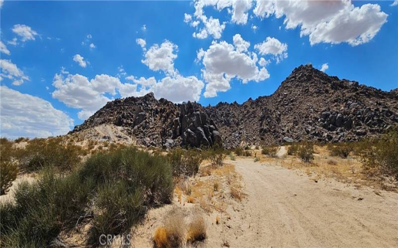 Not the actual property. Giant Rock is right around this mountain. This picture was taken approximately 7 minutes from subject property. If you drive in this direction, the roads become extremely sandy. 4x4 wheel drive or quad strongly recommended when driving towards Giant Rock.