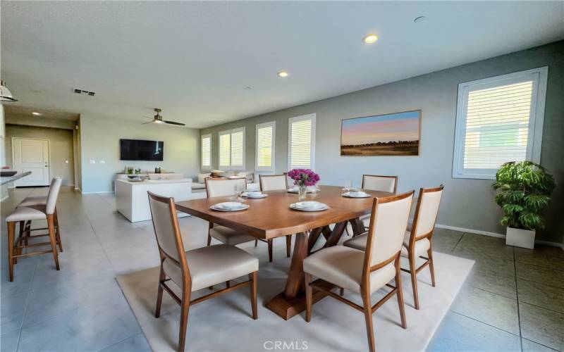 Dining Area Opens Into The Living Room Virtually Staged