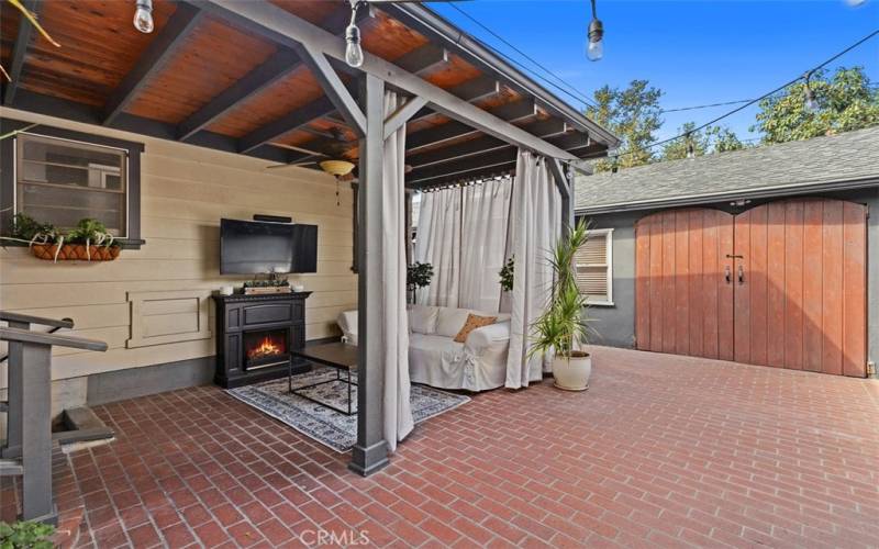 Undercover patio. TV Couch, coffee table.