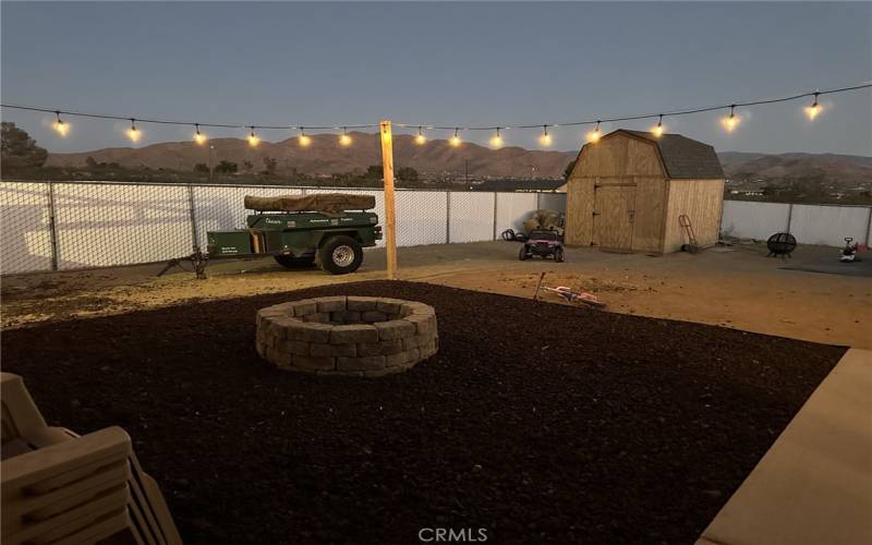 Back yard with firepit and shed