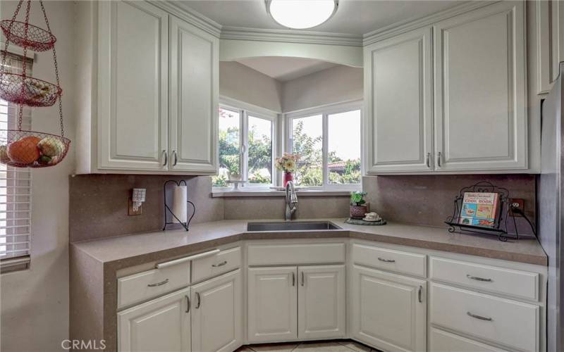 Kitchen with Caesarstone countertops and freshly painted cabinetry