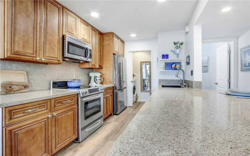  Oversized granite counter, perfect for cooking and entertaining. updated