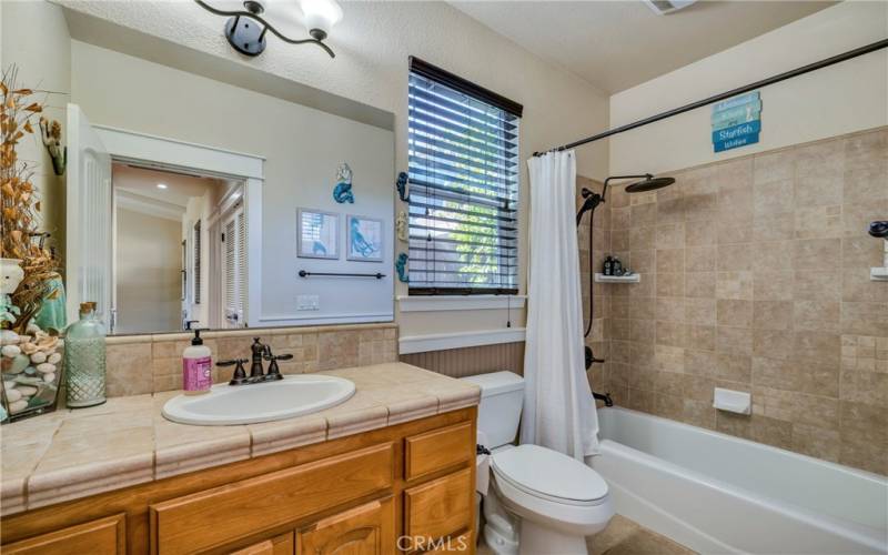 Beautiful hall bathroom with tile shower