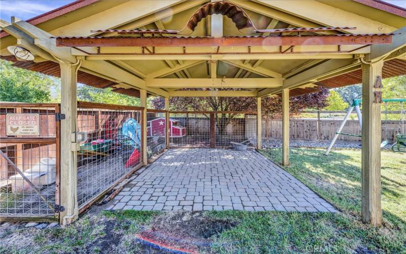 Enjoy outdoor living with this pergola that has power and a ceiling fan.