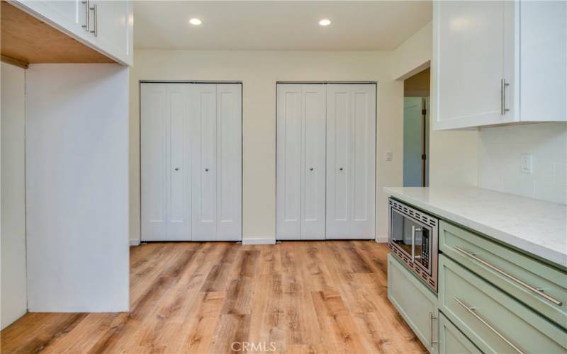 Dual closets at end of kitchen area