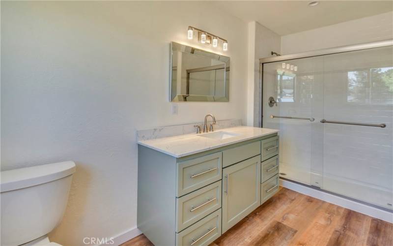 Spacious bathroom with step in shower