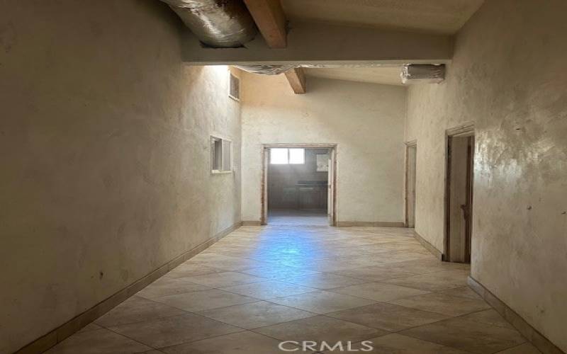 Hallway leading down to three remaining bedrooms and one bathroom.