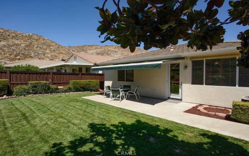 Backyard with retractable shade awning