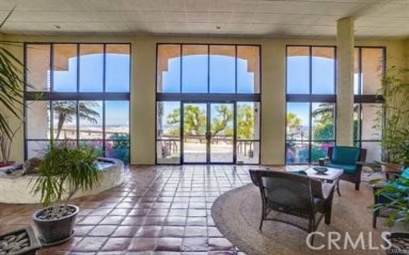 Inside spacious lobby looking out towards Panorama Drive and mountains beyond