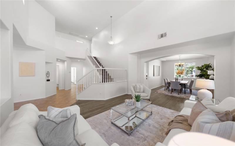 Another view of living room and staircase