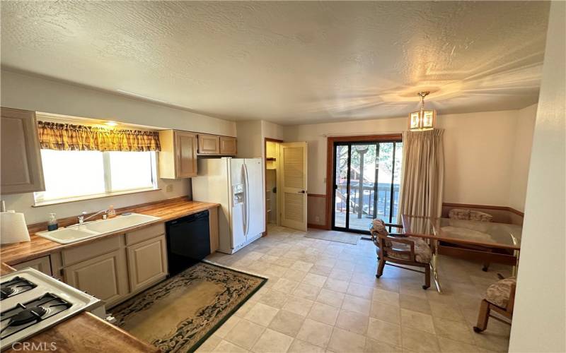 Spacious Kitchen with Slider Access (with Security Screen) to Deck