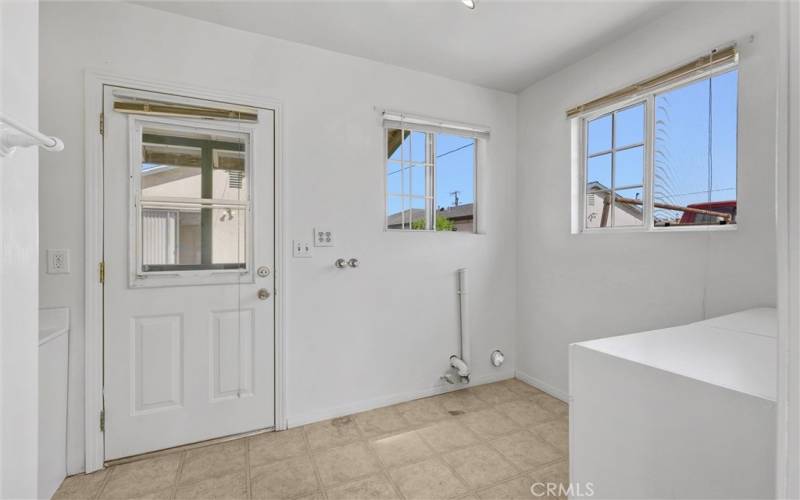 Indoor washer/ dryer hookup laundry room.