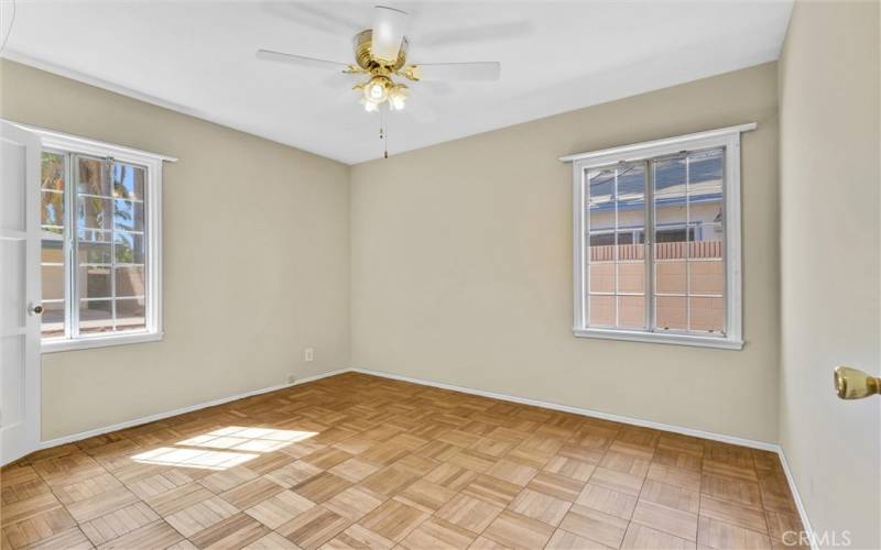 Lots of light in the freshly painted 3rd bedrooms.  Parque flooring.