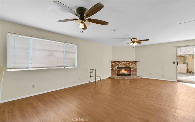 Huge and open floor plan family room with fireplace and a lot of light.