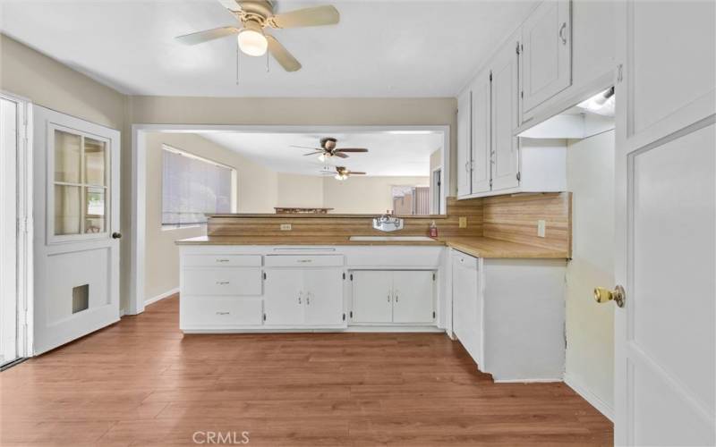 Plenty of cabinet space in freshly painted kitchen.