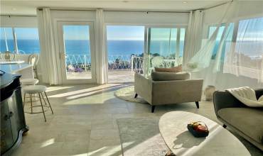 Sit down ocean views in living room.