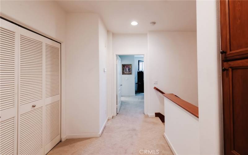 Washer and dryer closet at the top of the stairs