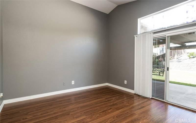 Primary bedroom with slider access to the rear yard