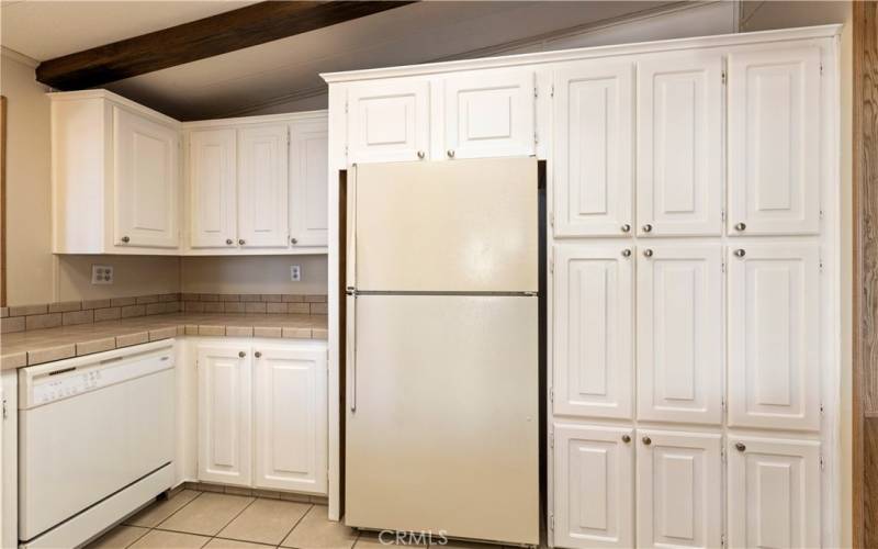 Kitchen, Lots of cabinets and refrigerator is included.