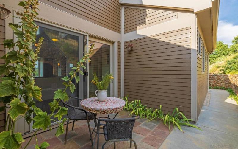 Shaded courtyard with custom built stone pizza oven.