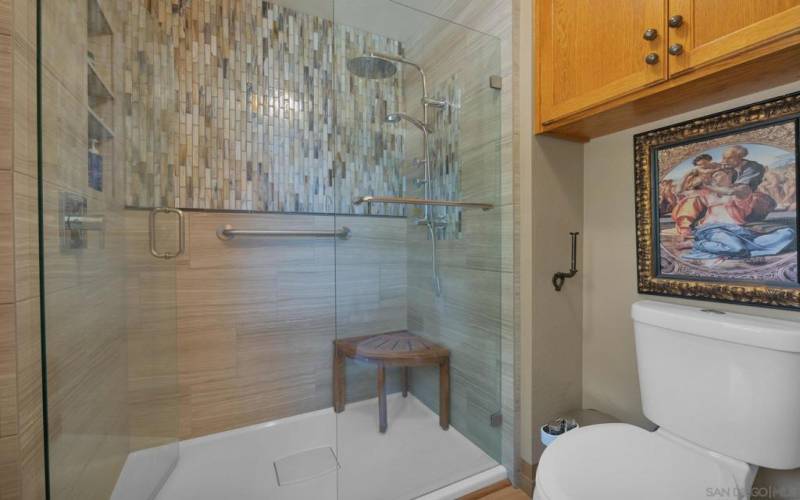 The generous walk-in shower with custom tile.