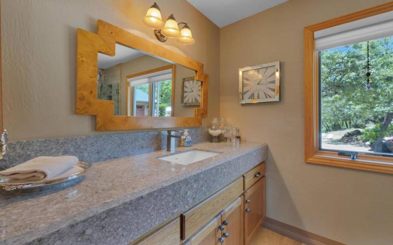 Granite countertops extra high and well-appointed with modern fixtures.