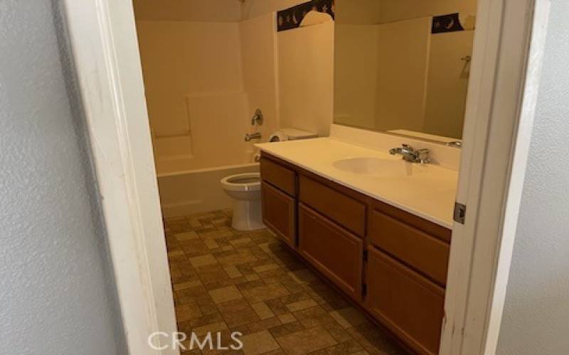 Bathroom 1 by family room in 14615 Tucson St, Victorville CA 92394