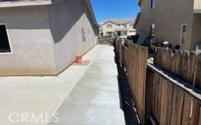 Outside backyard right side of house at 14615 Tucson St, Victorville CA 92394