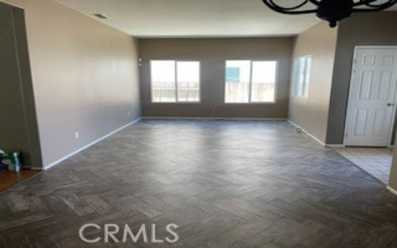 Other side view of formal living room in 14615 Tucson St, Victorville CA 92394